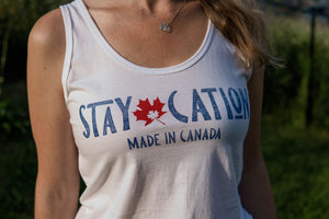 close up of the staycation logo on the tank top